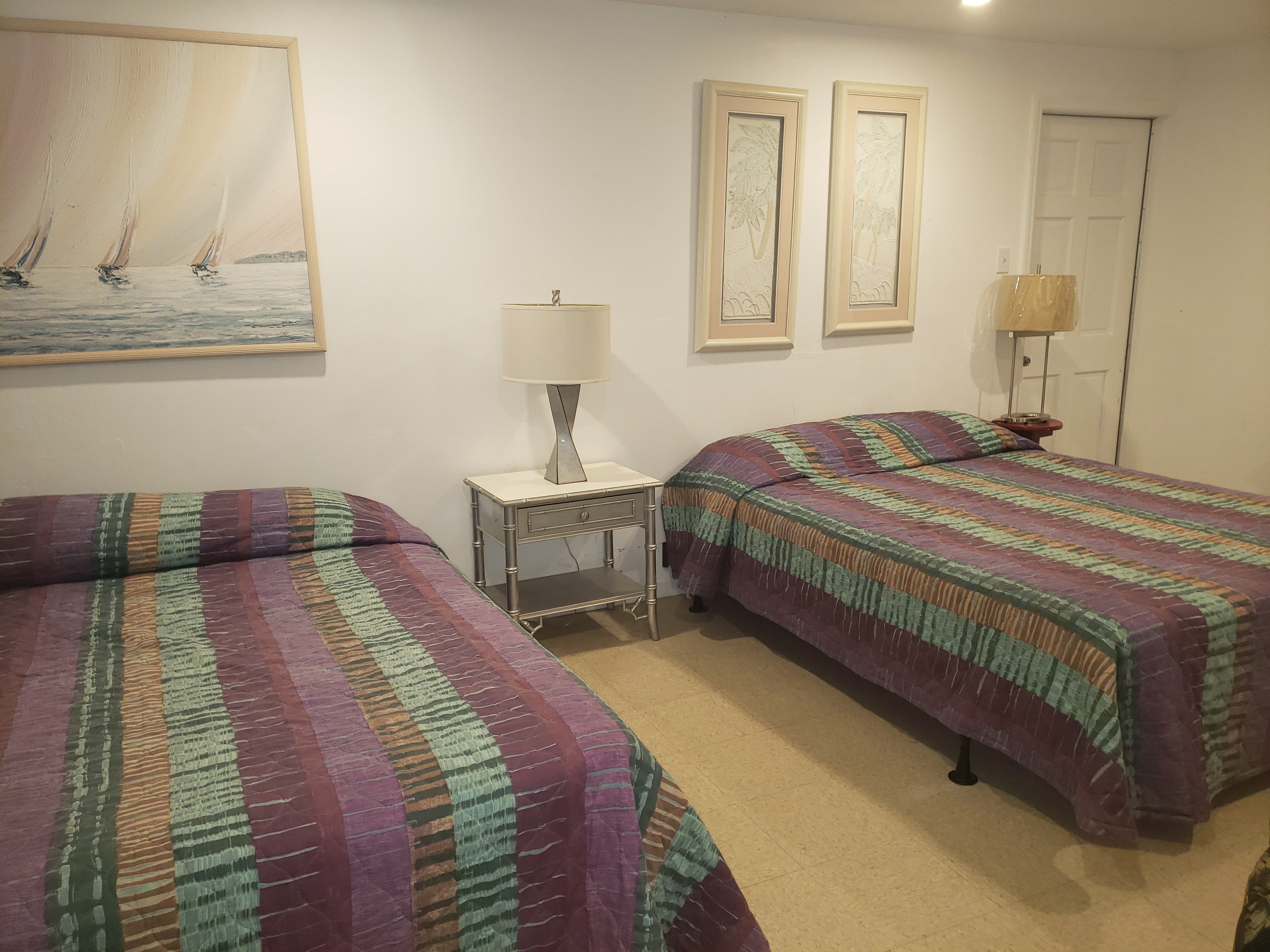 3 Bedroom Cabin double beds with artwork